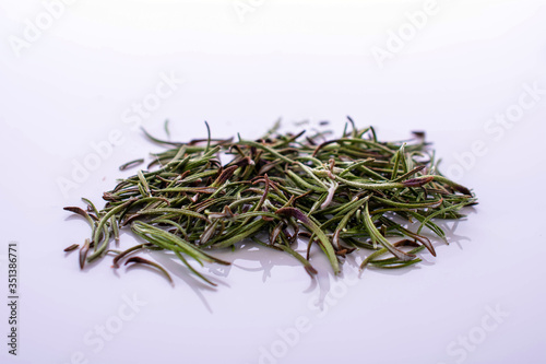 dried Rosemary on white reflective