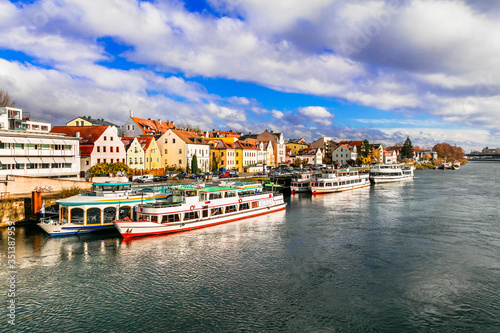 Beautiful towns of Germany - scenic Regensburg over Danube river famous for cruises. Landmarks of Bavaria