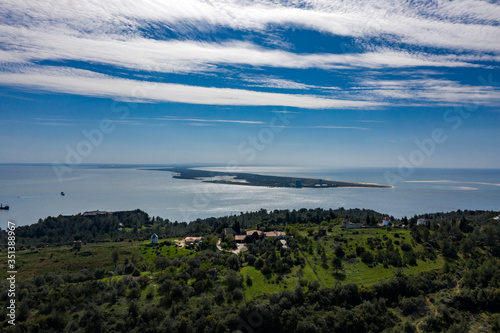 Troia Peninsula, Setubal, Portugal - May 8, 2020 - Aerial Bird's eye view of Troia Peninsula on a sunny day, near Lisbon. Sado river in the background