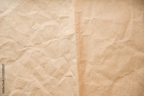 Craft paper sheet crumpled and has a beige shade