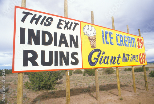 Indian Ruins billboard next to Ice Cream and Milkshake advertisement in NM