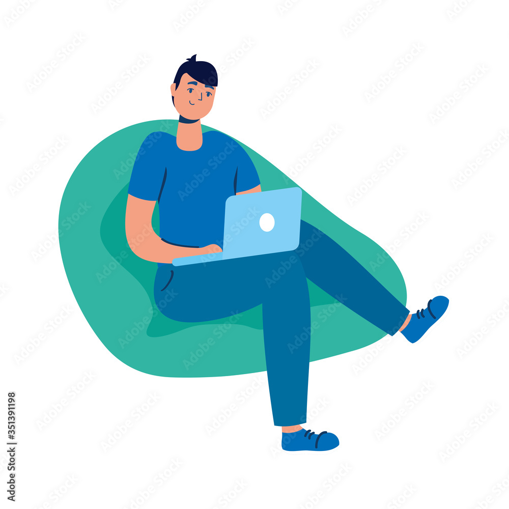 young man using laptop seated in sofa