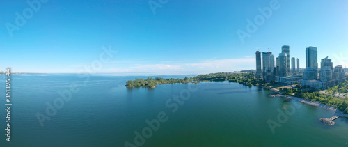 Panorama of Humber Bay Shores Park city view, green space with skyline cityscape downtown. Skyscrapers over The Queensway on sunset at summer time, near Etobicoke or New Toronto, Ontario, Canada photo