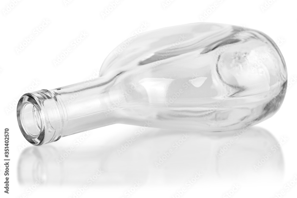 Fototapeta premium empty clear cognac bottle isolated on white background