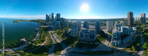 Artistic creative view of Humber Bay Shores Park city view and green space with skyline cityscape, azure lake Ontario. Skyscrapers over The Queensway on sunset at summer, Etobicoke, Ontario, Canada photo