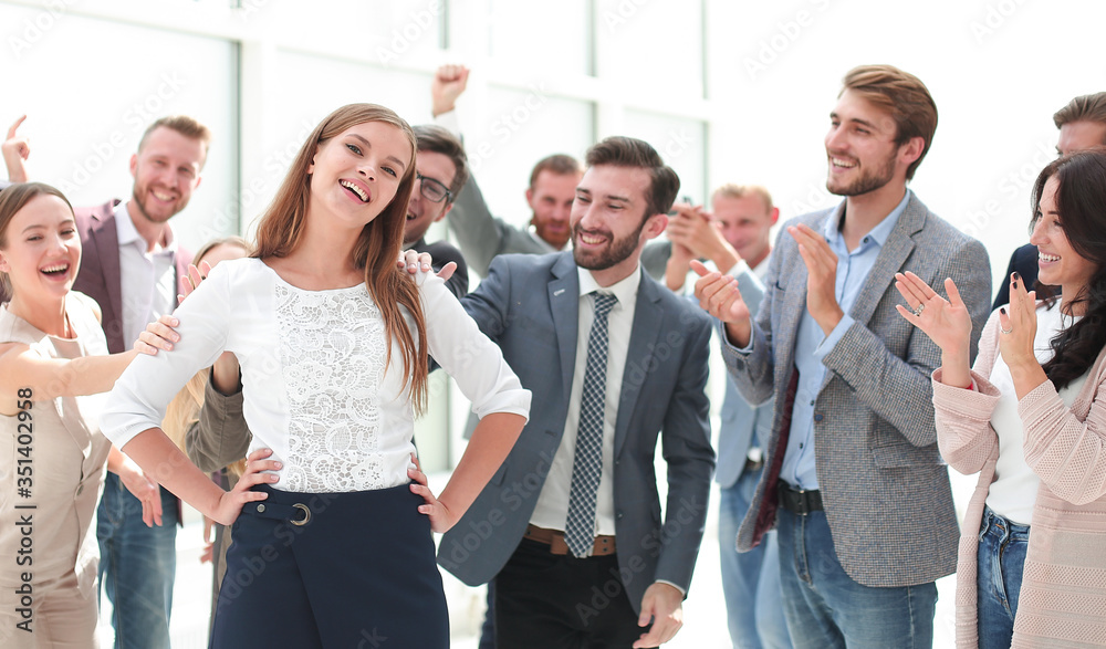 Fototapeta premium creative business team congratulating their young colleague