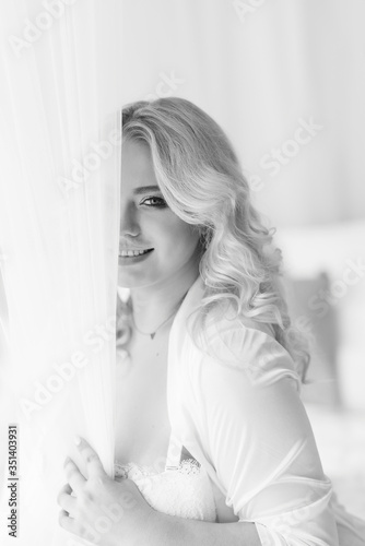 blonde girl plus size model in white lingerie portrait Bali morning bride color