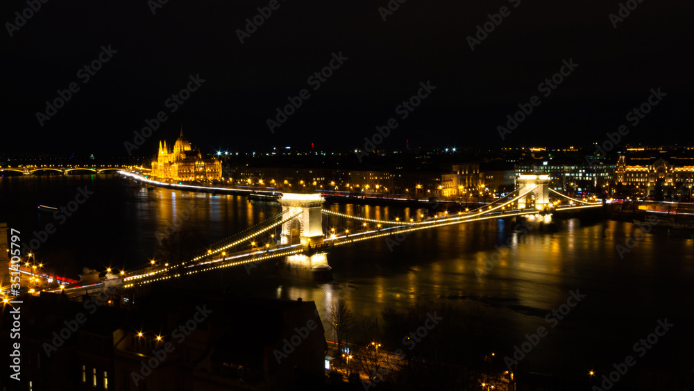 views of the European city of Budapest, capital of Hungary, illuminated at night next to the Danube river.