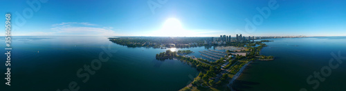 Amazing North American panorama at Humber Bay Shores Park city and green space, skyline cityscape, yacht and boats in azure lake Ontario. Skyscrapers and blue marina, sunset at summer, Ontario, Canada photo