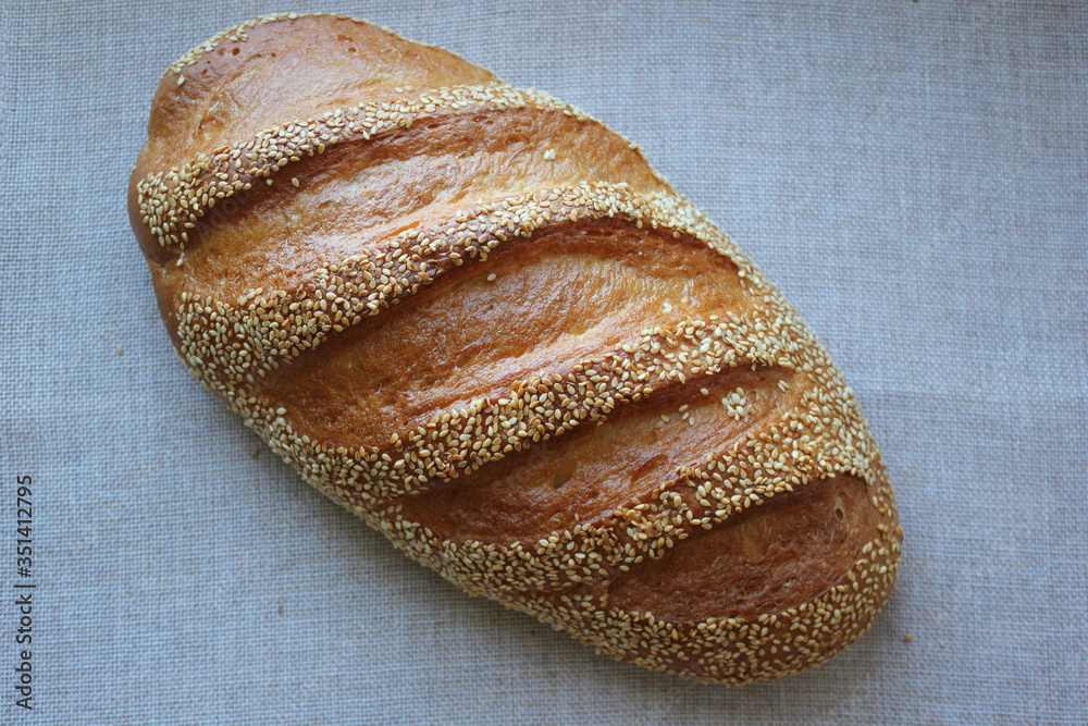 close up of bread. bread with sesame seeds. fresh bread on a wooden table. homemade bread with sesame seeds. ukraunian bread close up of bread. bread with sesame seeds. fresh bread on a wooden table. homemade bread with sesame seeds. ukraunian bread