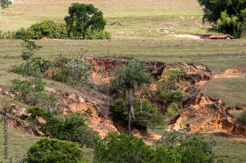 soil eosion on hill with pasture in Brazil photo