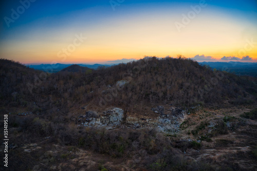 This unique photo shows the hilly landscape, from hua to thailand, taken with a drone by the evening sun during a wonderful sunset!