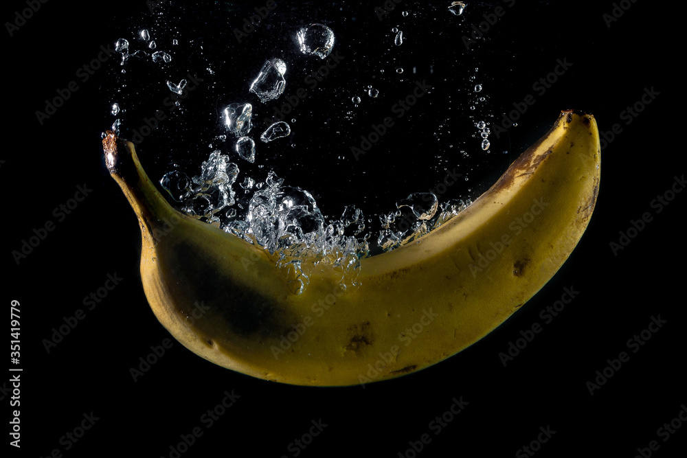 banana entering the water and splashing