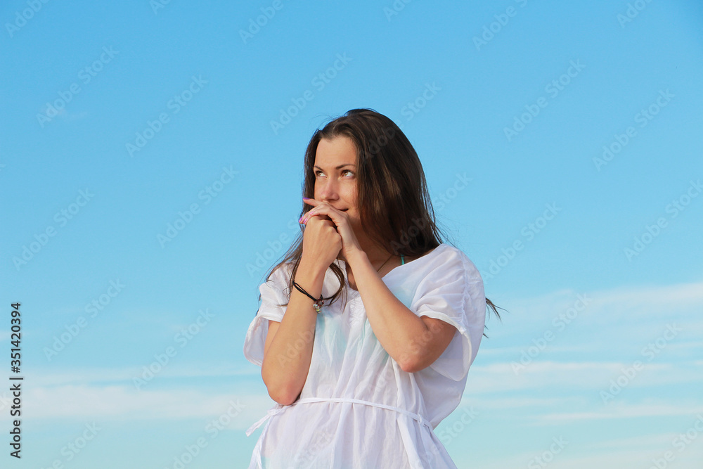 girl on a background of blue sky girl on a background of blue sky