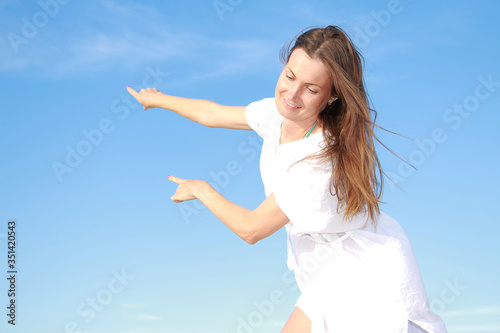 girl on a background of blue sky