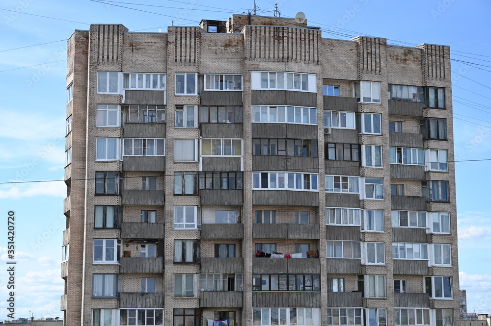 Typical 16 storey Soviet brick block in Saint Petersburg in spring Typical 16 storey Soviet brick block in Saint Petersburg in spring