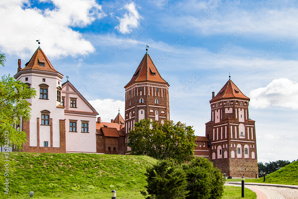 Mir, Belarus. Medieval castle on a background of blue sky. Summer panoramic landscape, ancient architecture