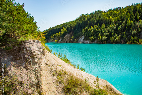 Mountain lake with bright turquoise water. Summer landscape on a sunny day.