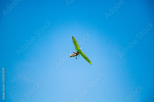 Hang glider in the blue sky. Extreme sport, air flights.