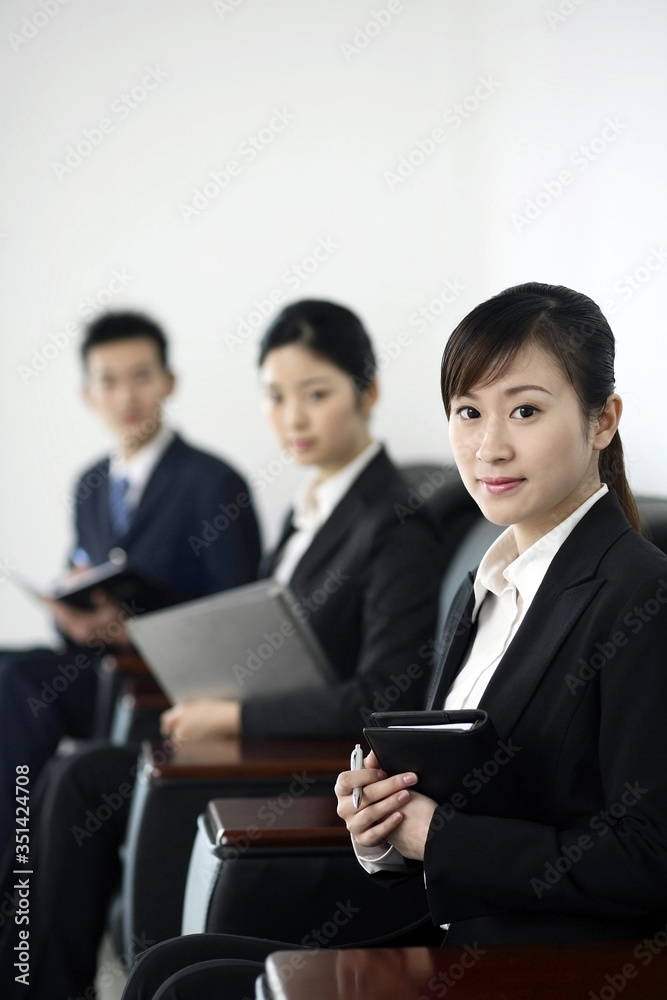 Business people smiling at the camera Business people smiling at the camera