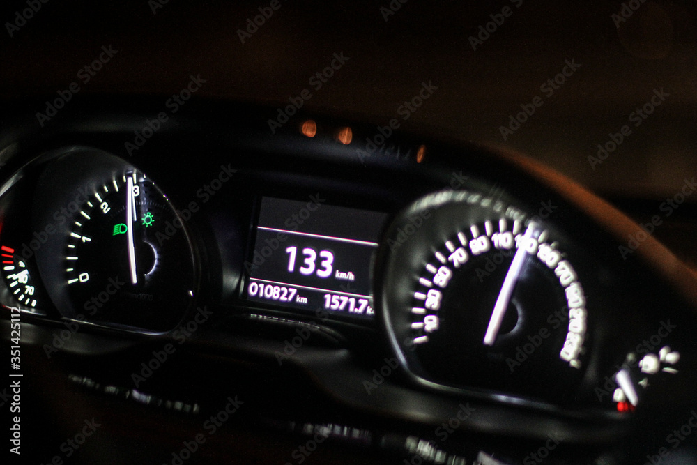 Front illuminated car panel at night, speed and dynamics