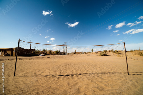 beach volleyball net on desert