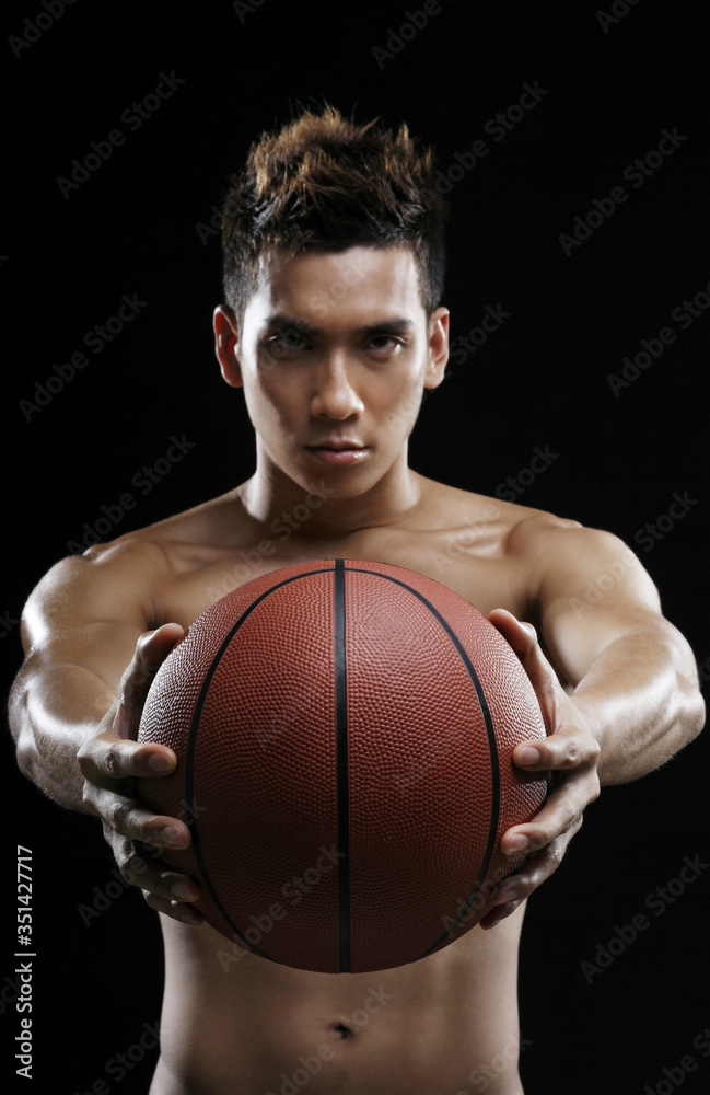 Man with basketball staring at the camera Man with basketball staring at the camera