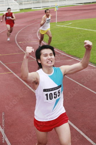 Man running to finish line