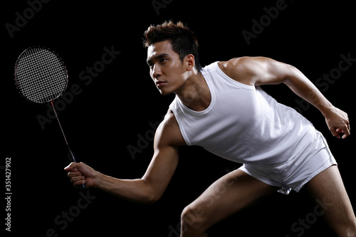 Man playing badminton © ImageHit