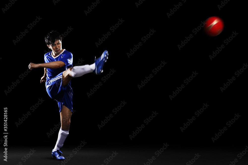 Man kicking ball