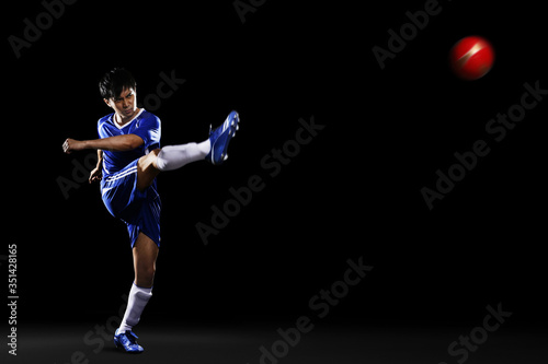 Man kicking ball © ImageHit