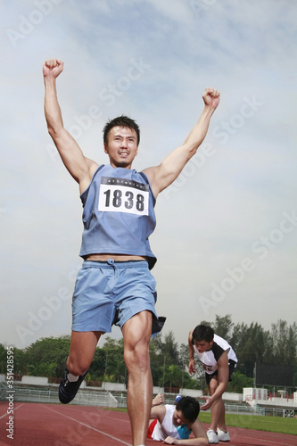 Man upon reaching finishing line