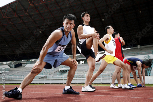 Men stretching before a race