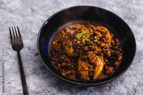 plant-based food, vegan baked potatoes with beans and lentil curry
