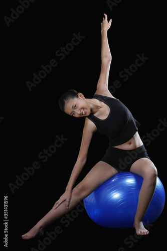 Woman exercising with fitness ball