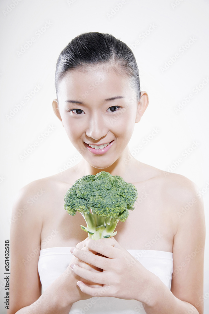 Woman holding broccoli Woman holding broccoli
