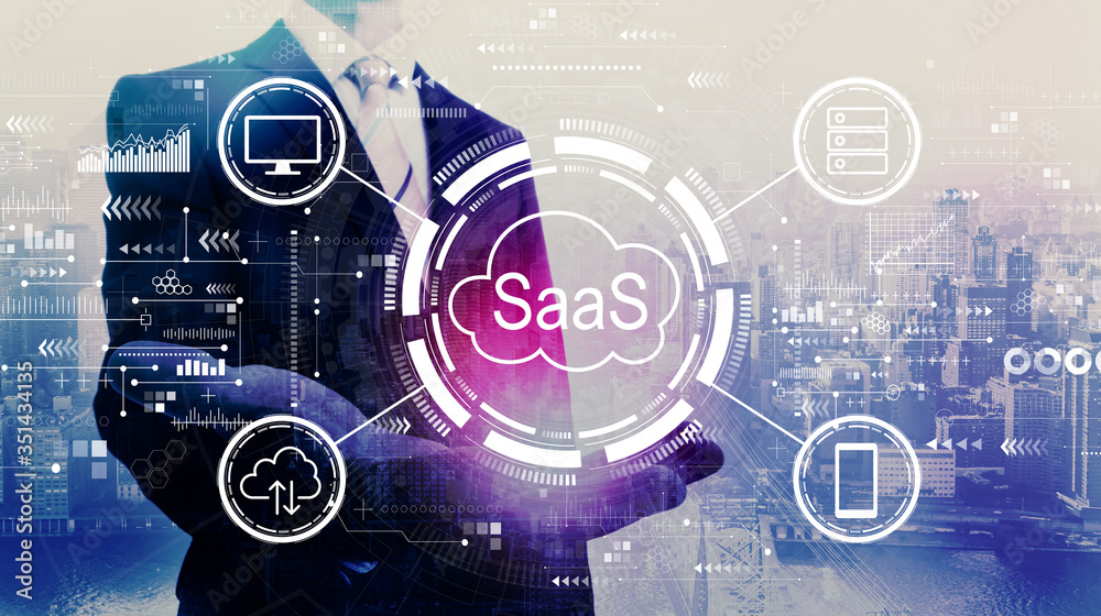 SaaS - software as a service concept with businessman on a city background SaaS - software as a service concept with businessman on a city background