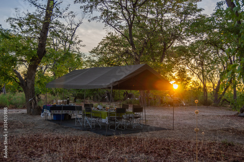 Sunrise on a safari camp in the Botswana wilderness