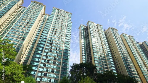 Wallpaper Mural Low angle shot of high-rise residential buildings against blue sky Torontodigital.ca