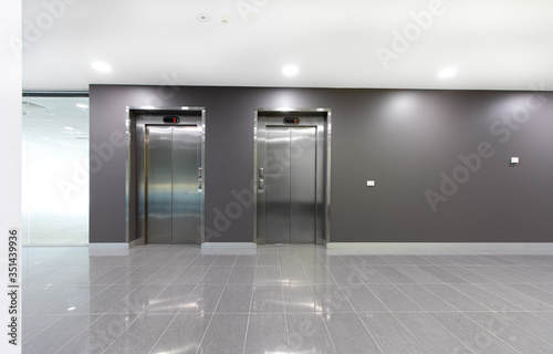 Two lifts or elevators in a building lobby. photo