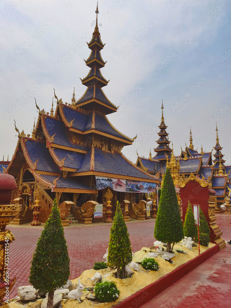 Buddhist temple, blue pagoda with multiple roofs. Northern Thailand. Buddhist temple, blue pagoda with multiple roofs. Northern Thailand.