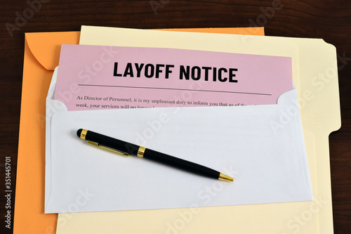 An illustrative image to show a letter sent to employees or workers of layoff notice. Business concept image for unemployment. photo