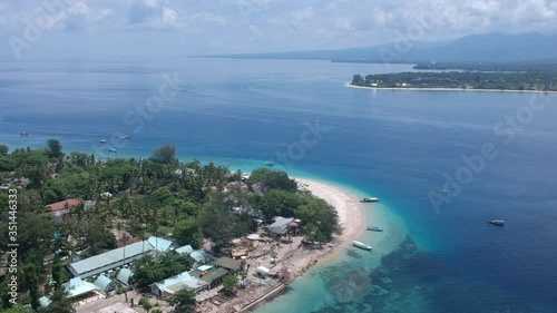 drone flying around the edge of the island gili air