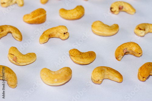 Roasted Cashew nuts isolated on white background with clipping path and full depth of field. Set or collection.