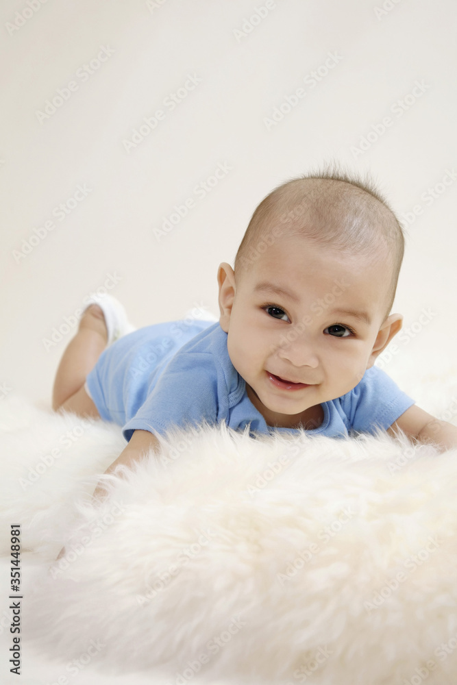 Baby lying forward on fur Baby lying forward on fur