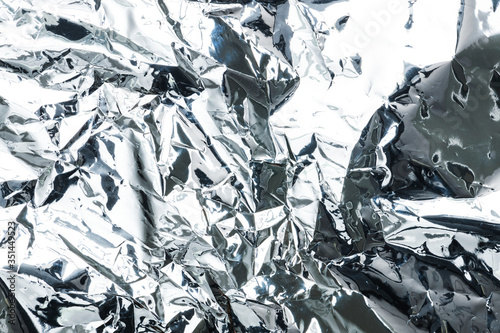 Crumpled aluminum foil textured background