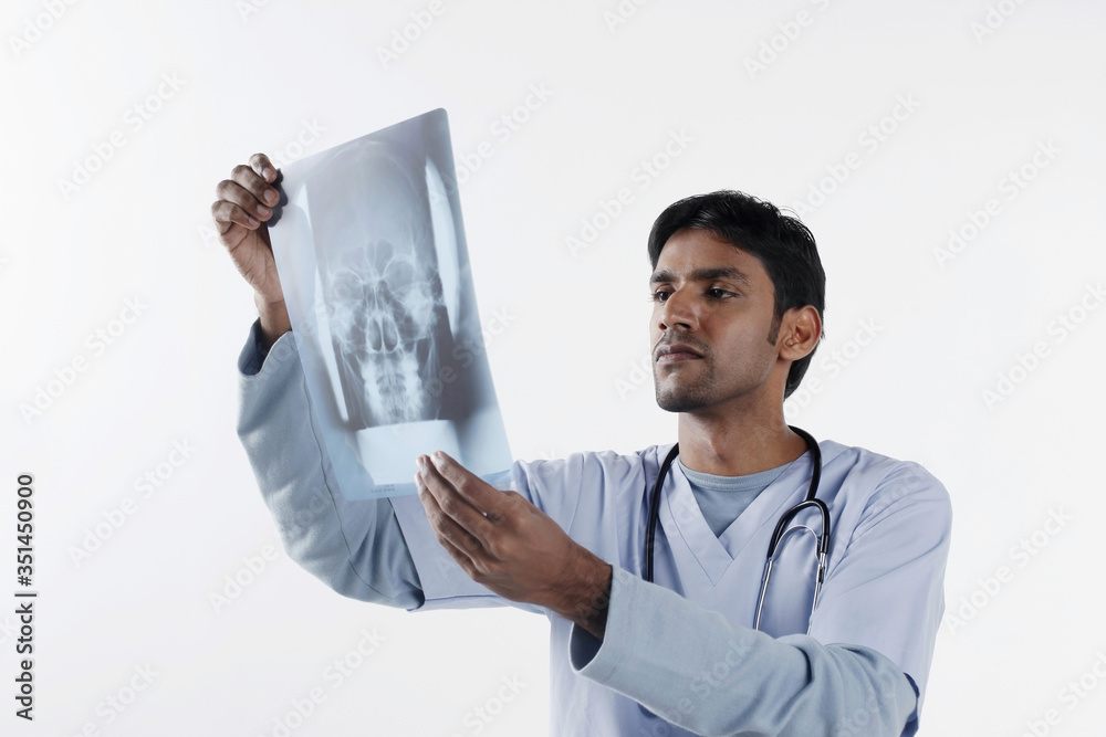 Doctor examining x-ray Doctor examining x-ray