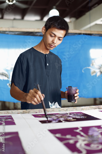 Photography Man painting batik fabric