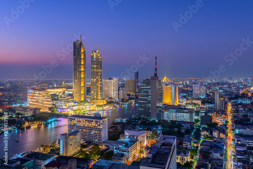 View of Bangkok cityscape. Aerial view of business modern building around the Chao Phraya river in Thailand at twilight time. © Jack