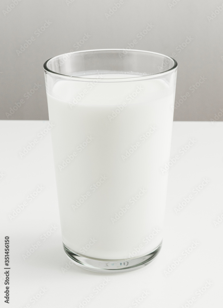 Fresh milk in a glass on a table Fresh milk in a glass on a table